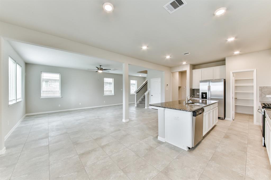 **Home is Under Construction. The photo shown here is of a completed home that has the same floor plan and similar elevation. Options and color selections may vary.**
