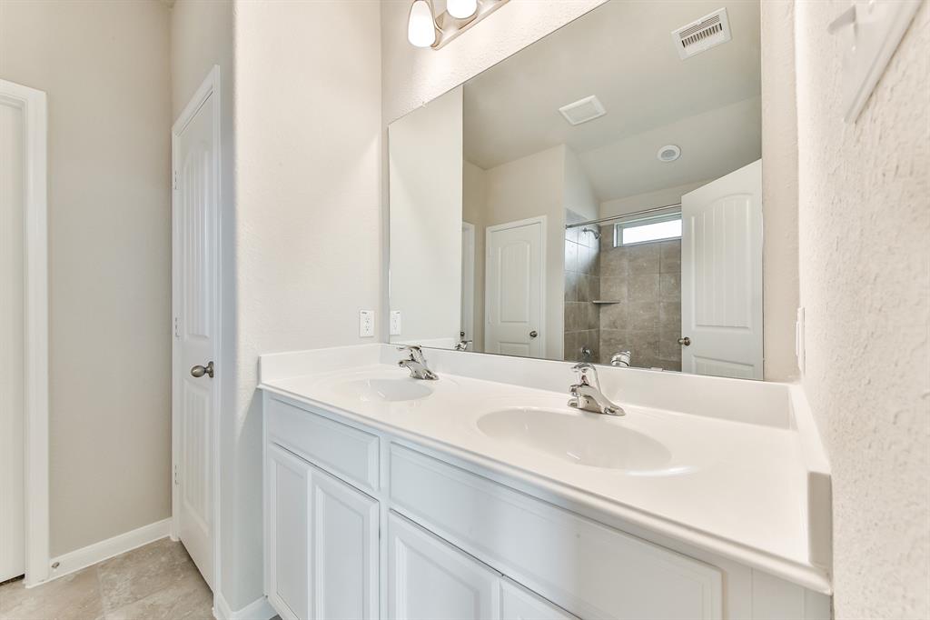 **Home is Under Construction. The photo shown here is of a completed home that has the same floor plan and similar elevation. Options and color selections may vary.**