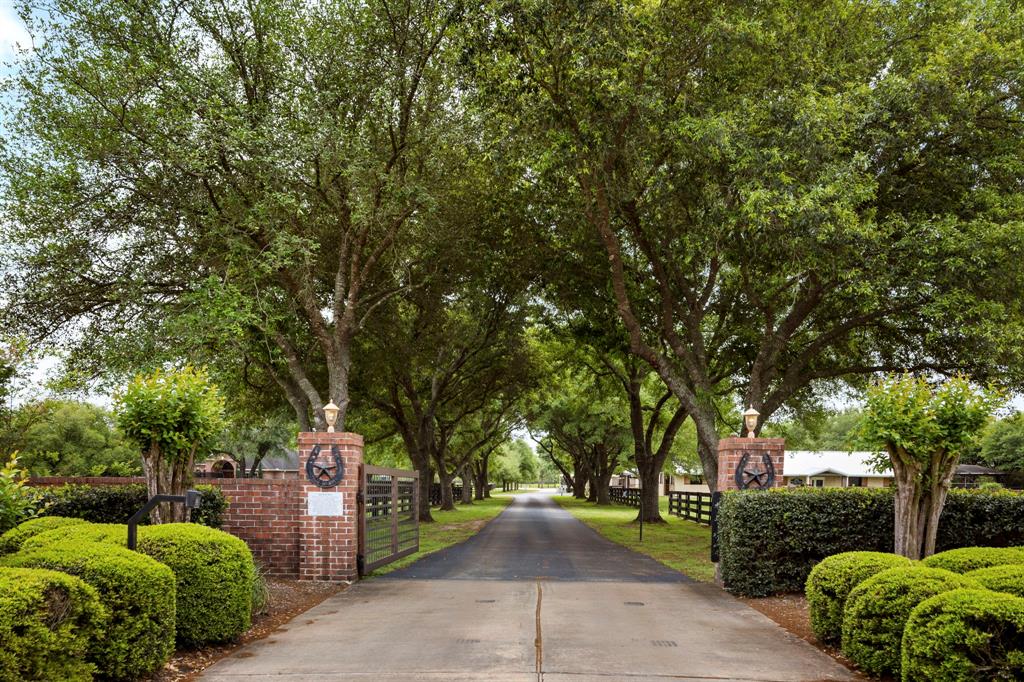 Experience the equestrian lifestyle on this breathtaking country estate!  This stunning property sits on 15 beautiful acres.  The oak-lined driveway, bordered on each side by 2 large turnout pastures, leads you toward 1 of 2 custom homes (the larger of which offers a swimming pool and outdoor kitchen), a 15-stall quality built concrete block barn, an 8-stall shed row barn, a 200x90 covered arena, open arena, and a 50 ft Euro walker.  As you drive thru the property you will find 7 more turnout pastures, a large pond, and the second custom home.  Along with the opportunity of luxurious country estate living, the barns offer the perfect boarding setup with tack rooms, a bathroom with laundry, and wash racks. In addition, the property is currently income-producing with an onsite veterinary clinic renting one of the buildings.  Contact us today for further details or to set up a private viewing.  Conveniently located
