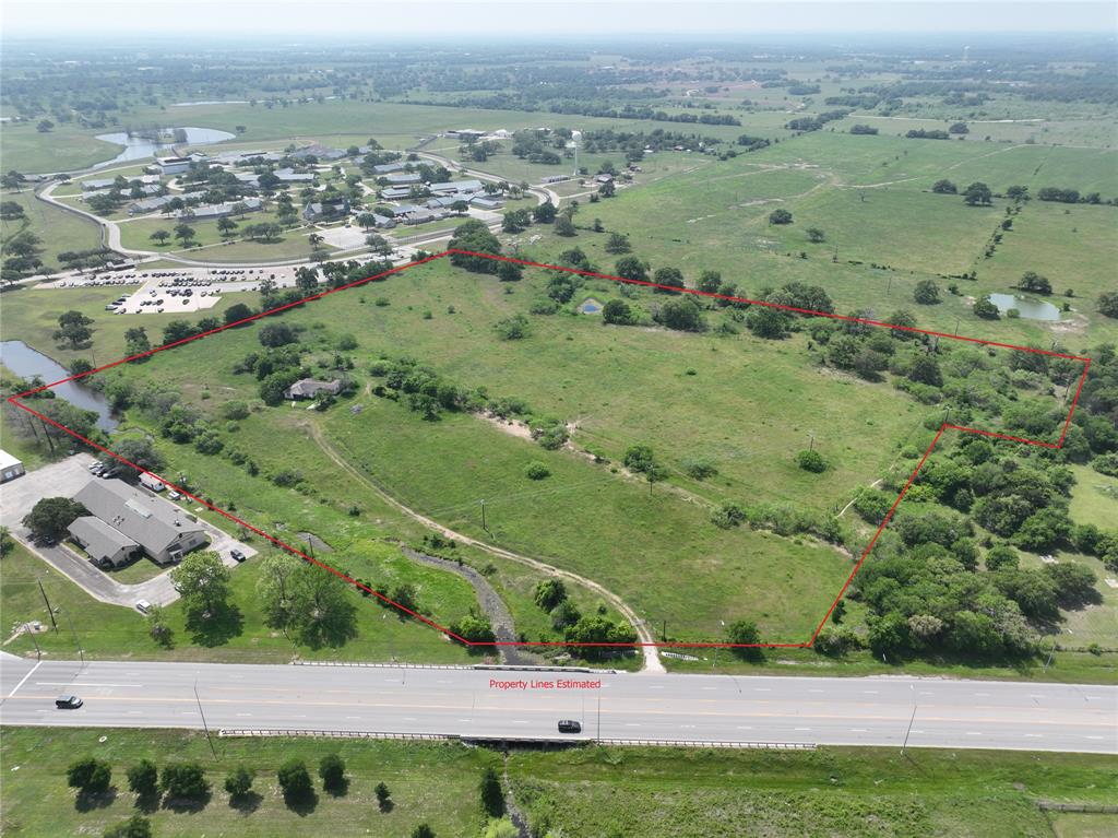 If you are looking for a development property, land investment, or a small ranch with great potential this property is suitable for all buyers. Only 1 hour from Austin Bergstrom International airport and 1.5 hours from Houston you will find 21.6 +/- acres of ideal development land that has 286’ +/-  road frontage located on Highway 290 in Lee County. 11 +/- acres are in the city limits and the other 10.6 acres can be converted to city limits with a commercial development. This property offers endless opportunities being in the Designated Opportunity Zone, commercial development, and with no known restrictions. There is also a small house in need of renovations on the property with city water and electricity services. Buyer to verify all room dimensions.