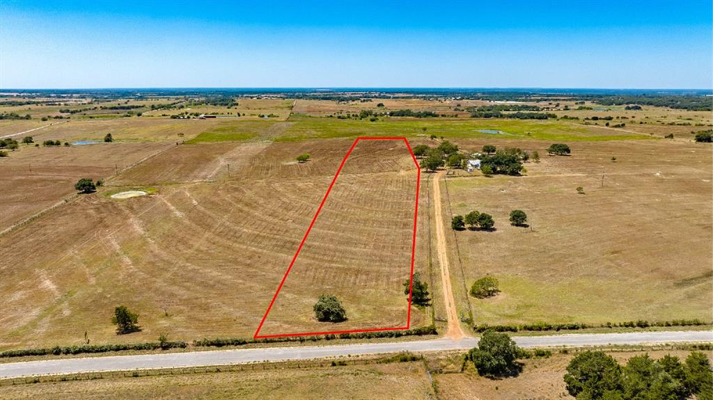 Small acreage tract about 90 minutes from Katy or San Antonio. Gently sloping cleared terrain. Seller will include barbed wire fencing and entrance gate. Fayetteville Electric CoOp poles on the tract. View from the road, no access at this time. 
Light restrictions include no additional subdividing; one mobile, built 2000 or later per tract; 200ft building setback.
Final acreage and price is subject to final division approval by Lavaca County.
Part of R200951325.