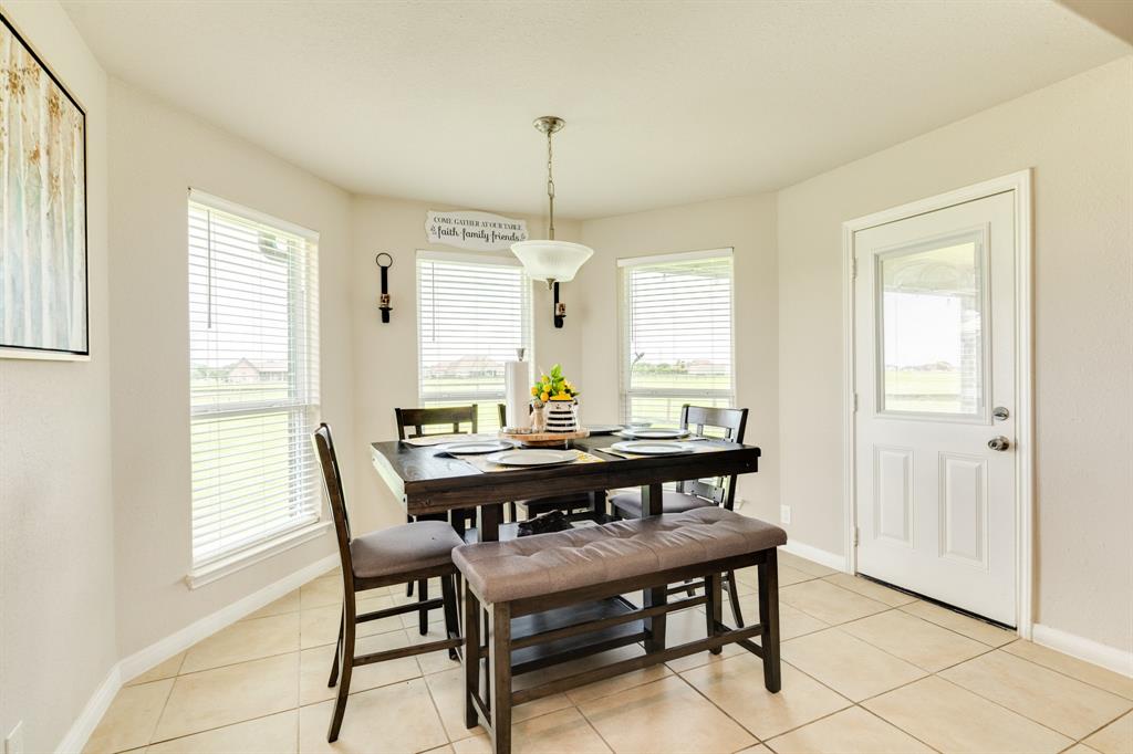 Breakfast room with many windows and tons of natural light.