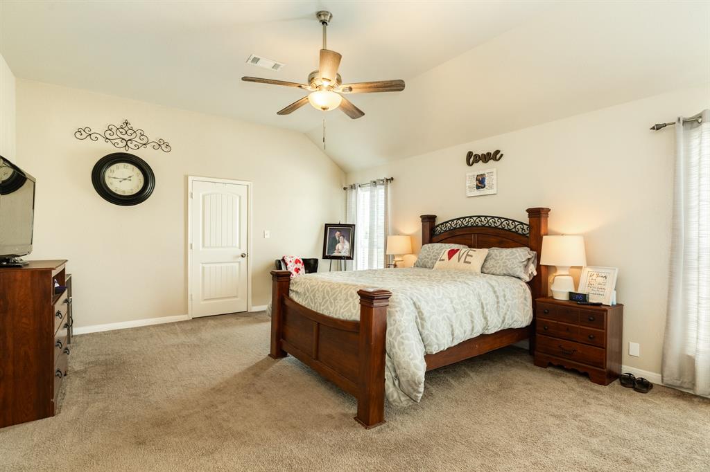 Primary bedroom with two large walk-in closets