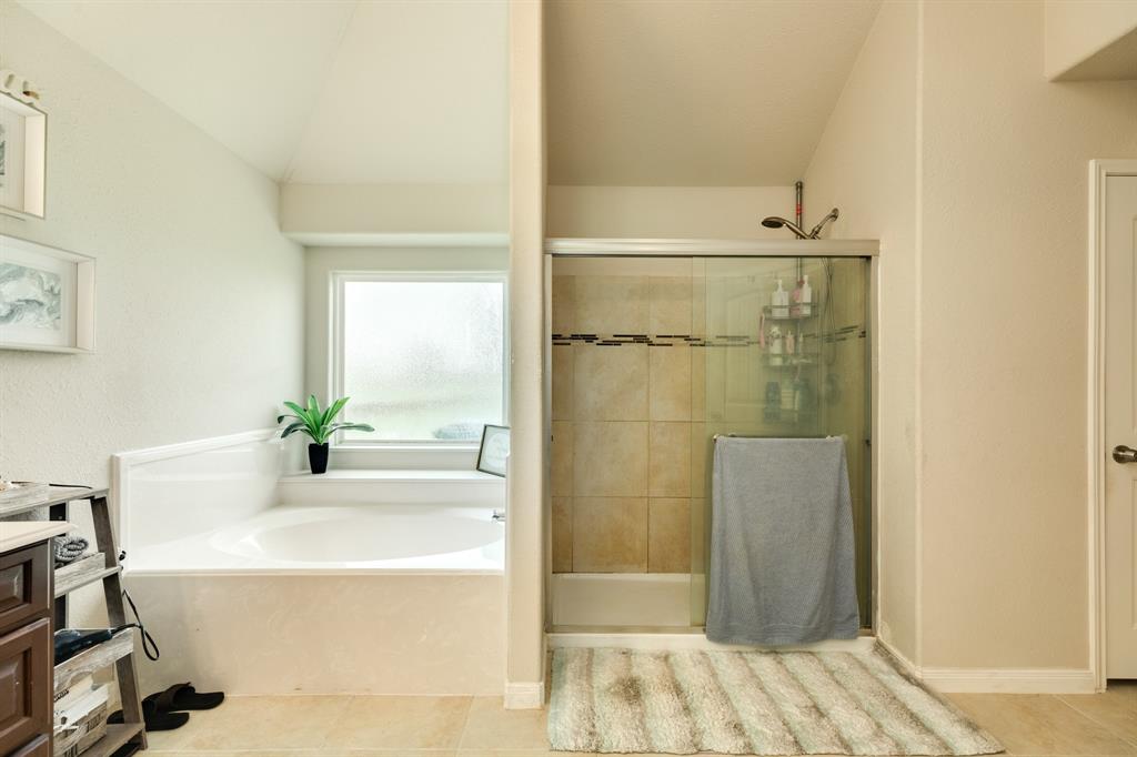 Soaker garden tub and separate walk in shower .