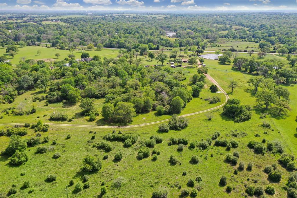 Beautiful rolling tract of land with areas of open pasture, scattered trees, clusters of large trees and a nice pond.  Excellent building site for long distance views or a beautiful small enchanted forest to tuck in a secluded home.  Entrance has been permitted by TXDOT for access from FM 529, there is Austin County Water Supply is available on FM 529 and Reliant Energy is available at the back of the property.
Property will be lightly restricted. There is a verbal grazing lease which will be terminated on closing.  Please do not enter the property without an appointment, the dogs will need to be put in their pen.