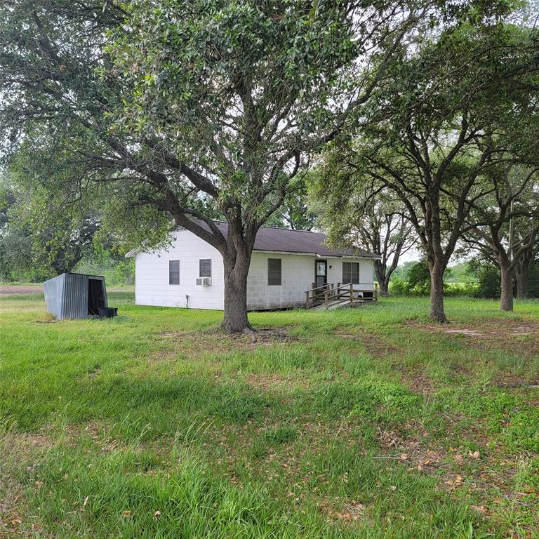 34.8 acres of farmland with small home could be renovated for office or rental property  sitting between matured oak trees. Property has water well, septic system, electric and propane tank. 330 ft +/- frontage to FM 1489, . Property is also accessible from Macha Road on backside. All but one acre is ag exempt for cotton crop. Seller to retain minerals. Within 30 minutes drive to Simonton, Wallis and Rosenberg Richmond.