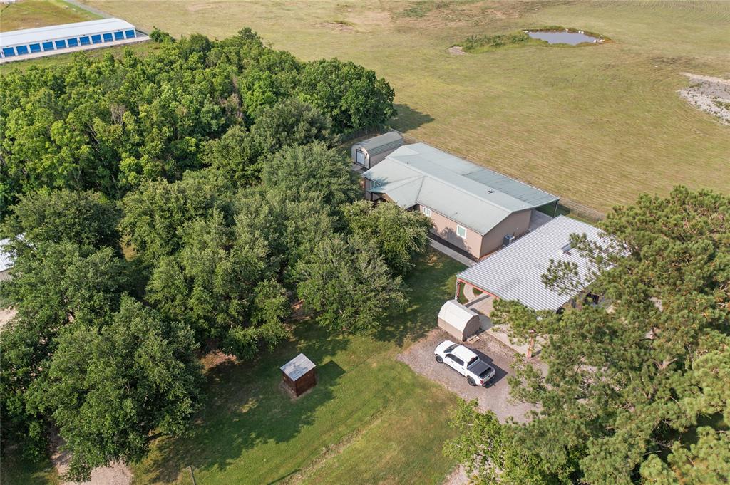 Great FM 2100 Location, 3 commercial Buildings 2 acres with large double wide completely remolded. Granite counter tops, 2 on suites, 2 living areas, fully fenced. Live and work on this unique property. Great investment