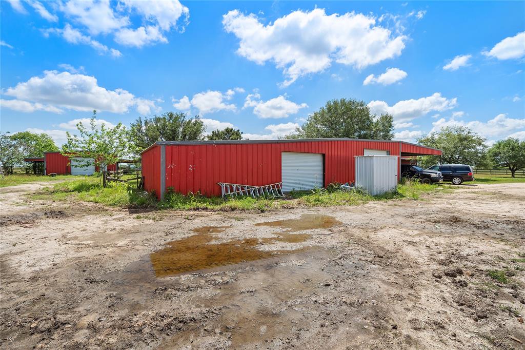 Two large doors at the shop and an enclosed well house.