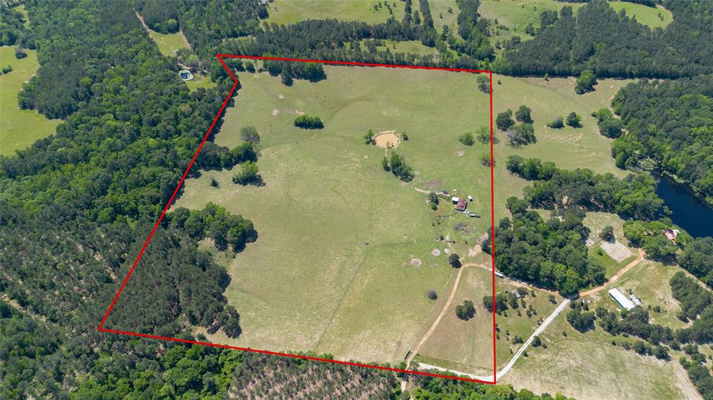 This beautiful country property located at 357 PR 5042 in Grapeland, TX offers a rare opportunity to own 54 acres of prime land that has it all. The land boasts an iron ore in the top layer of the surface, is well-drained, and is perfect for native bahia and bermuda forage. Approximately 5 acres of young timber is available to harvest, providing the perfect opportunity for a new owner to make use of the natural resources on the land. Includes crossed fencing for breeding. A new water well drilled in 2021 and a septic tank have been added, and a 200-amp electricity barn is in place, ready for use. The property is also set up for building a new home, providing the perfect opportunity to customize your dream home in a beautiful and serene setting. To make things even better, the property comes with an M Series Kubota tractor and mower. Don't miss out on the chance to own this beautiful piece of Texas countryside. Schedule a viewing today!