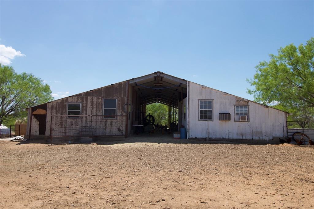 Front view of the barn and storage area currently being used for chickens.