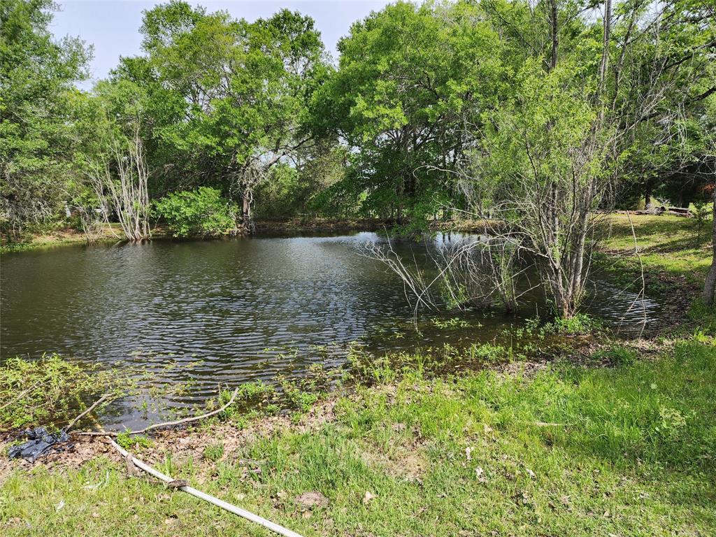 LOOKING FOR AN ESCAPE FROM THE CITY? THIS IS IT !!! YOUR PLACE IN THE COUNTRY! approximately 10 ACRES @ 7375 Live Oak has the the trees & the wooded reserve. Cleared spaces to put your dream home or your weekend cabin. To top off all that, you can look forward to a beautiful pond that is  tucked into the wooded space, a peaceful spot, great for fishing. The property has an older mobile home in the process of a remodel, however it is unfinished a. The mobile can remain on the property, but being sold as land only. There are several benefits to this property over raw land. Property already has Electricity, a Septic System, a Well, as well as access to city water and carries an existing AG exemption! The pond, besides it's beauty, it is great asset if you have livestock.  The beauty of this property speaks for itself. This 10 acres in the country is perfect for families that want to move out of town. Only 10 miles from Madisonville and about 25 miles from Bryan/College Station. HURRY!