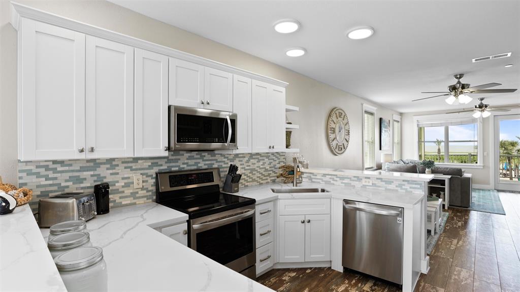 Gourmet kitchen with stainless steel appliances and ample counter space for meal prepping!
