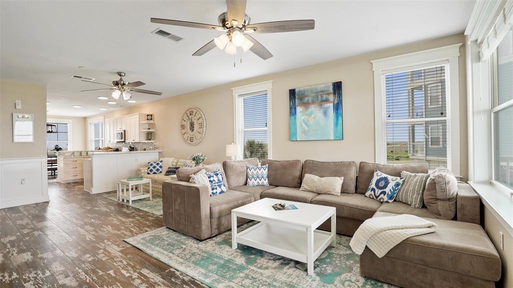 This beautiful warm, inviting living area where you can enjoy entertaining a few friends and take in the views!