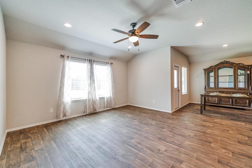 Living space off kitchen and dining.