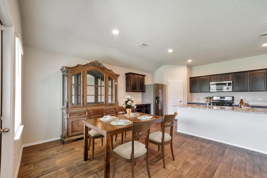 Dining room open t kitchen and living perfect for entertaining.