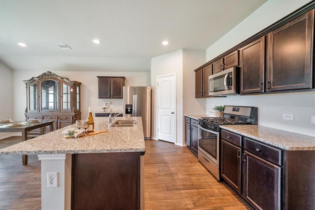 upgraded dark wood cabinets.