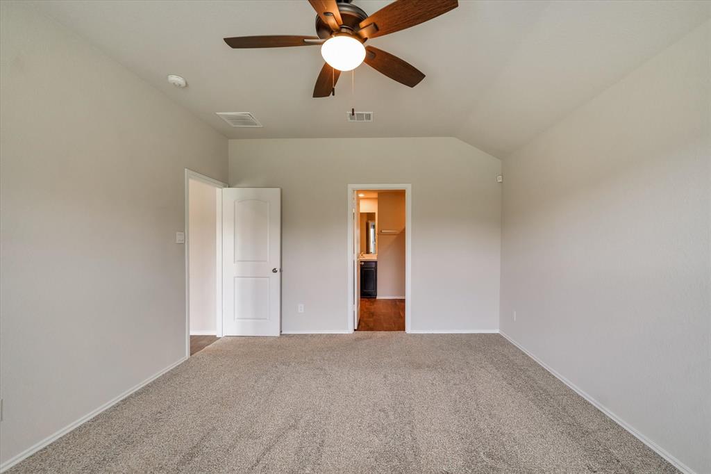 Primary Bedroom view that leads into the primary bathroom.