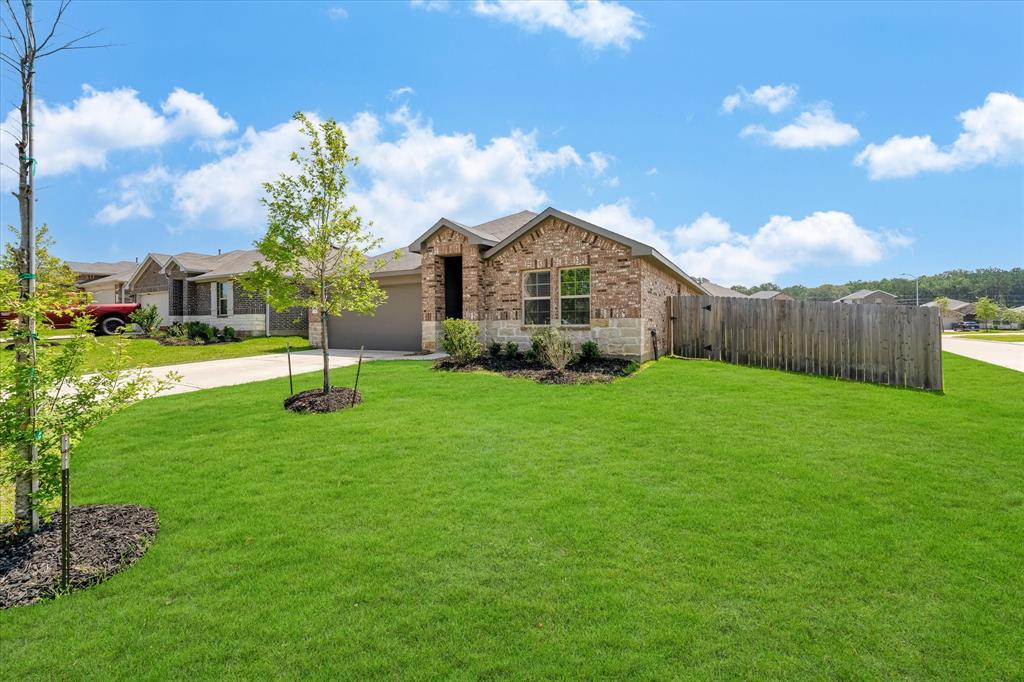 Home is located on a spacious corner lot.