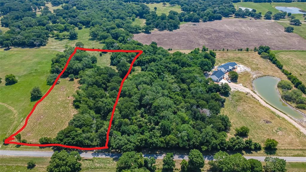 Approximately 7 acres out of 17 acres that will be subdivided. Survey will be done by Seller to be replated. Great land that has trees and creek that run along the property. Approximately 400 square feet of road frontage. Property is partially in the flood zone.