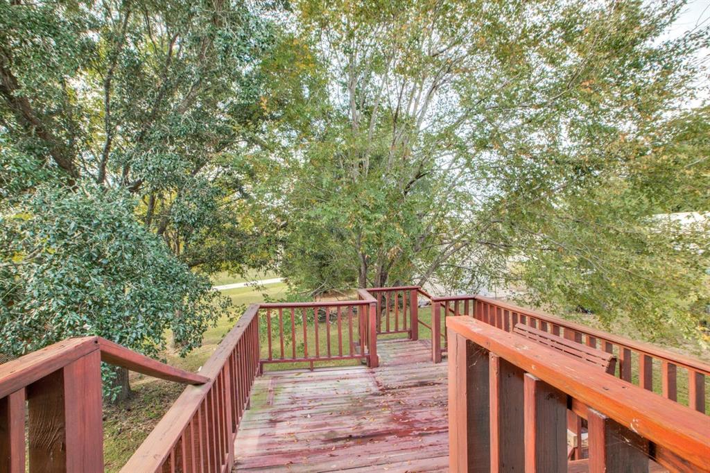 Back Deck and stairway off the upstairs bonus room.