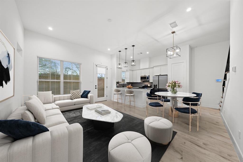 Enjoy first-floor living with high ceilings, great natural lighting, and engineered wood floors throughout. Designed for sophisticated entertainment, the living area opens to the kitchen and dining areas — all offering plenty of space for seating.