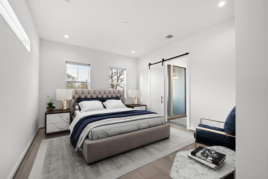 Restful days await in the primary suite featuring a seating area, recessed lighting, engineered wood flooring, and single-hung windows with tree-lined views. Built for convenience, find a sizable ensuite bath offering generous storage space along with an incredible walk-in closet.