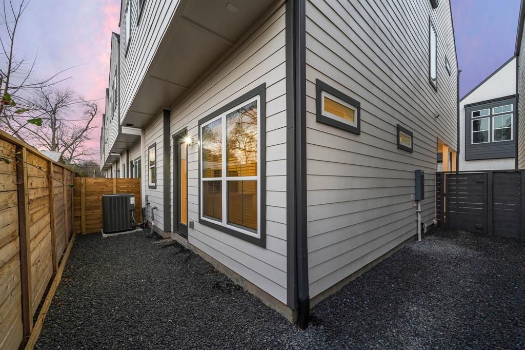Accessible from the living area, a lite door opens to the fully-fenced backyard with black gravel landscaping, offering ample room for a garden or a dog run. This versatile outdoor space provides an excellent opportunity to unwind and relax, breathe in the fresh air, and soak up the sun.