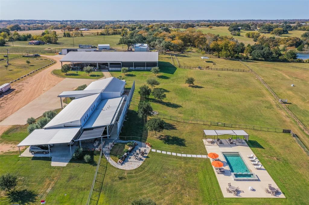 Rancho Martita may be the most impressive equestrian property on the market today. Every aspect of its design & development was engineered & constructed with a focus on quality, functionality and attention to detail. You'll be hard-pressed to find a more stunning property with higher end improvements in a better location.  7 miles from Brenham in the most attractive part of the county. As you enter, your focus shifts to the covered arena & barn area. The main barn has 10 concrete stalls. The modern ranch style main home is the perfect place to relax or entertain. The Casita was remodeled in 2010 w/ an excellent eye for detail. Every acre is productive & part of a pasture system suitable for horses/cattle. Regardless of equine discipline, the design, layout & construction allow for efficient mgmt of your operation. Water & Electrical were constructed to subdivision specs. All-weather roads & Extensive pipe fencing was built to last a lifetime & adds to the attractive curb appeal.