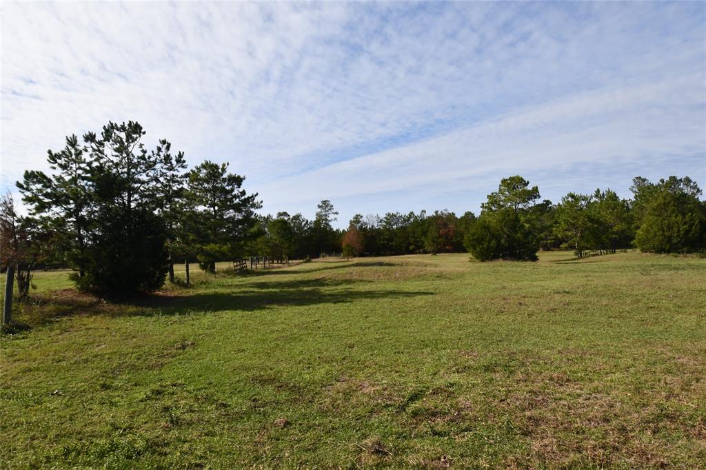 11+/- acres located just outside of Cleveland.  Enjoy the country while being not far from town.  Property is set up for horses.  3-stall barn with tack room & loft.  Several carports & outbuildings.  House needs work - listed at land value only.