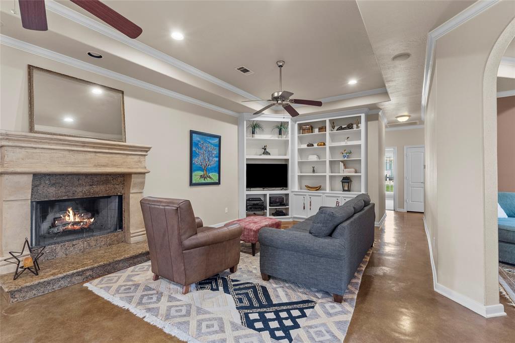 Living room with wood burning fireplace.