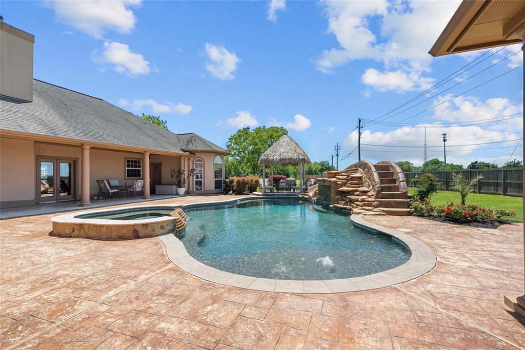 Beautiful heated pool with water fall, slide and spa/hot tub!