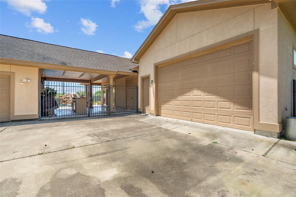 2 car garage/shop attached to the pool house.  Over sized 3 car garaged attached to house.