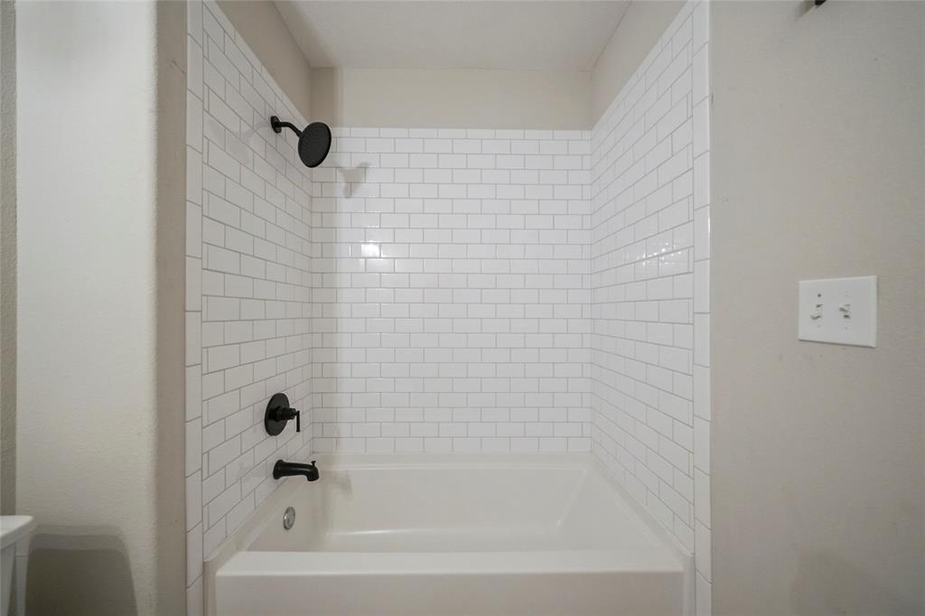 Shower/tub in second bathroom.