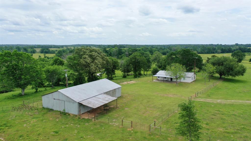 Located off Hwy 21 in Houston County is The HD Ranch. 233 acres ready for your next homestead, cattle ranch, or hunting property! The newly remodeled ranch-farm style home includes three bedrooms with two baths, featuring an open concept living room/kitchen/dining area, storm shelter, and a front and back porch that overlooks the beautiful rolling property. Throughout the house are all new appliances, alluring light fixtures, and an island perfect for entertaining that comes fully furnished. Beside the house is an oversized barn with a slab and lean-to set up for equipment and storage needs. This property includes improved pastures, a 20-acre hay field, fenced and cross-fenced, working/sorting cattle pens, three stocked ponds, and a spring fed-creek. Lots of wildlife for hunting. This property has no restrictions, is ag exempt, and is fenced around the exterior perimeter. This excellent location with highway frontage, rolling hills, and great views makes the HD Ranch limitless.