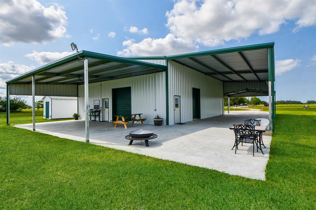 Country life at its best!  10 attractive acres with a 4640 sf slab with 4000 sf (under roof) including 752+/- sf of living quarters. 1 story, 1 bed, 2 bath with CAH, water softener & on demand water heater. Shop has LED lights*spray foam roof*10x17, 10x12 & 6x12 rollup doors*16' walls*camper stall w/50 amp plug & drain for sewer. 8x12 portable storage, 15x30 stock shed with 10x30 roof extension, corral, water & electricty.  200 gallon propane tank*2 water wells*aerobic septic system*beautifully manicured yard with a 1 acre pond filled with perch and bass*deck with electric & water*aeriation*water well for filling pond. Galvanized fenced perimeter with electric gate & cattleguard at entrance. Yard also fenced with cattleguard entrance.  Call for an appointment to see this awesome property!