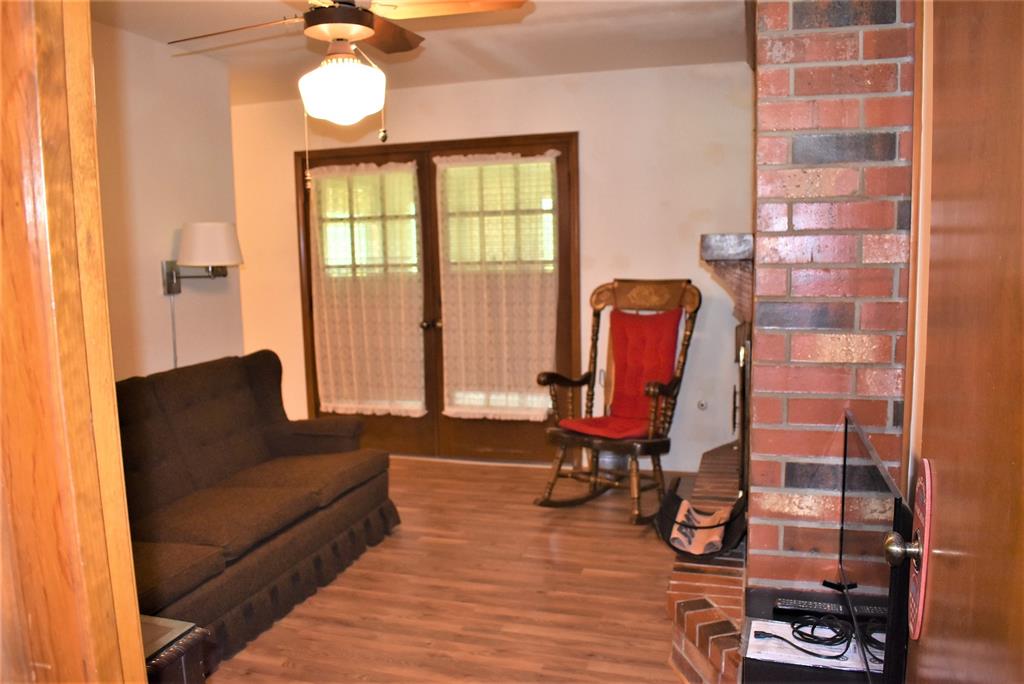 This cozy sitting room/office shares the fireplace in the living room and opens up to the gameroom/garden room as well! So nice if mom & dad are staying with you! It connect back down that hallway to the back left to the very large master bedroom