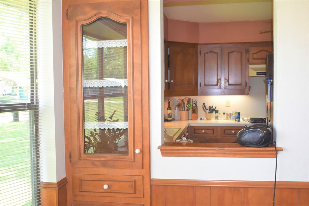 A small beautiful little built in hutch in dining room with opening to kitchen! Once again the wood work in this house is in impeccable condition and so well kept.