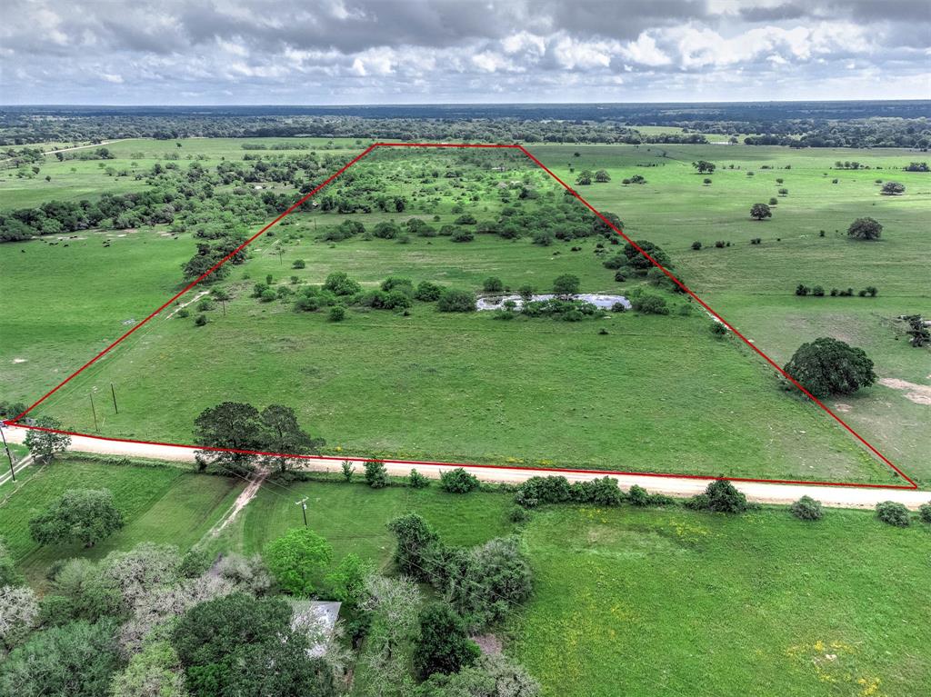 This beautiful country property consists of 44.65 acres.  There is a scattering of large trees with plenty of land for grazing.  The front consists of a hay meadow and slight elevation increase towards the back of the property perfect for a homesite. Hogs and deer are active on this property as it is currently used for cattle.  With county road 138 frontage, it is easy to access.   This property has 2 stock tanks, one very deep and neither ran dry during the last drought.  Electric is run to 2 spots on the property, the corral and near a Morgan building located on the property that conveys. There are 5 power poles currently on property.  Ag exemption currently in place.  Seller retains all mineral rights.  Set up a time to view the property today. Ask agent for video link of the property.