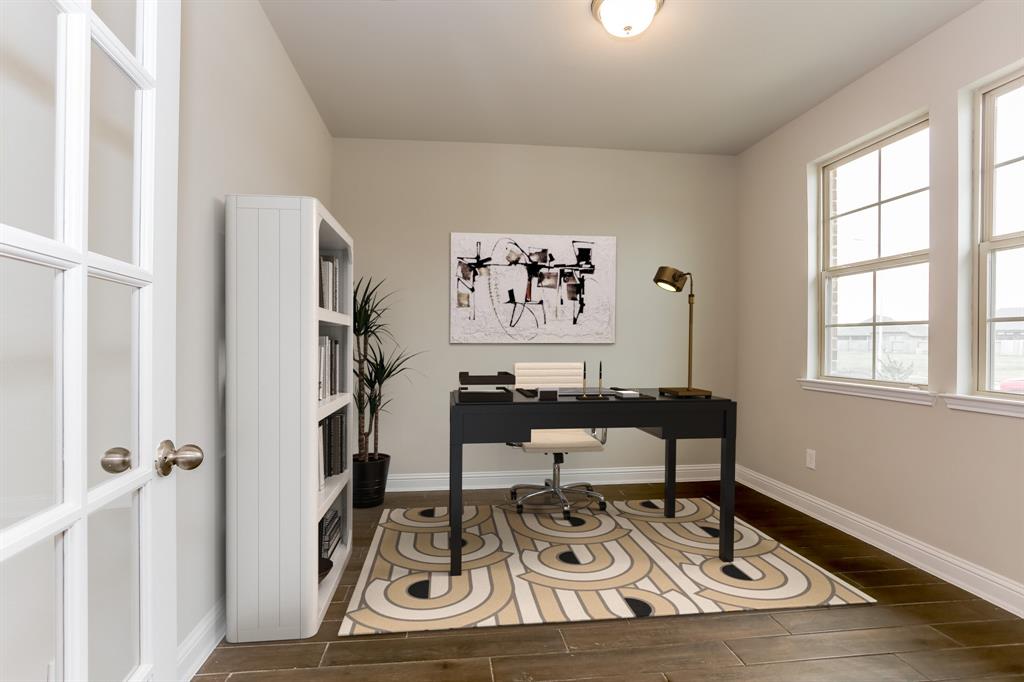 **Home is Under Construction. The photo shown here is of a completed home that has the same floor plan and similar elevation. Options and color selections may vary.**