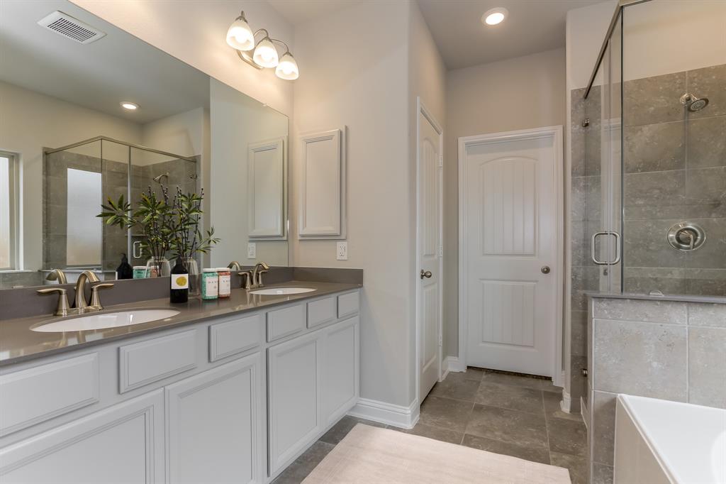 **Home is Under Construction. The photo shown here is of a completed home that has the same floor plan and similar elevation. Options and color selections may vary.**