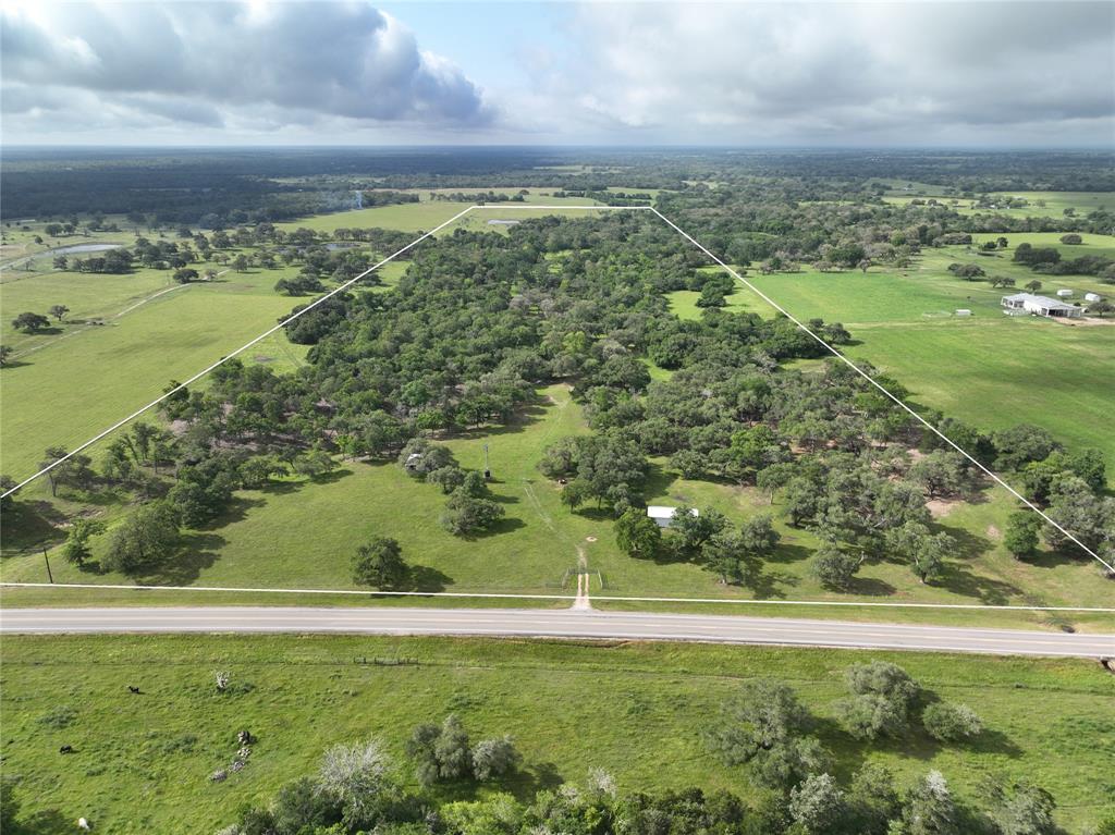 Located between Houston & San Antonio 5min south of Weimar, this +/-91 acres features unmatched diversity. Highlighted by an ideal homesite surrounded by Live Oak trees with cleared underbrush providing beautiful views of the varied terrain. Good fencing with separate pastures for livestock grazing & hay production. There's (2) barns utilized for storing equipment, tools & feed. Mostly wooded providing ideal habitat for the native wildlife & there's a pond for fishing. Electricity is available. There's a water trough serviced by a windmill. Mixture of clay, sandy clay & loamy fine sand soils. +/-1,000' of FM road frontage with an additional adjoining +/-85 acres to the east available for sale. 1hr 20min from downtown Houston & within 20 minutes of Walmart, HEB, dining, shopping & hospital in Columbus. No floodplain. Ag-exempt. Minerals negotiable (no active leases or production). NOTE- VIDEO IS OF +/-176 ACRES AVAILABLE FOR SALE. HAR MLS# 9428884. Come enjoy living in the country!