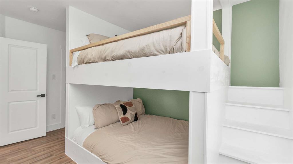 How fun! Queen over queen bunk beds with accent lighting for each bunk.