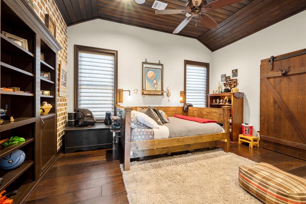 This bedroom has an eastern view of the property and great built in book cases which double as a study nook or panic room.