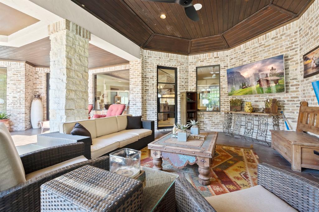Step outside to an entertaining paradise. Multiple living and seating areas.