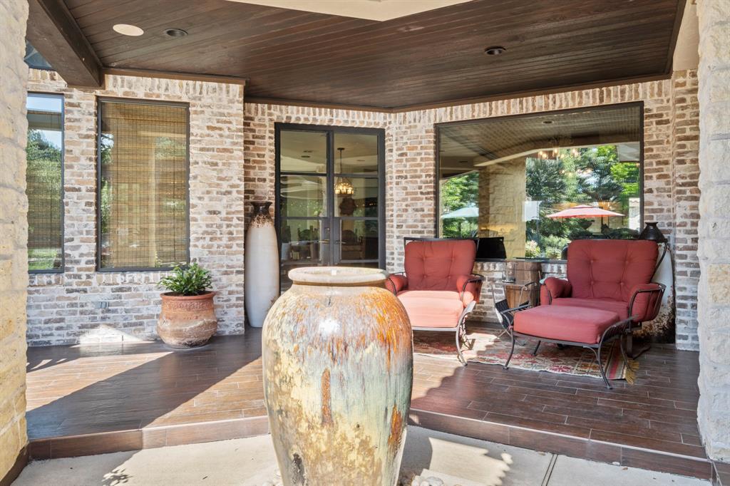 Another view of a great spot to view the pool and property. Area has wood paneled ceilings with recessed lighting and fans to keep anyone comfortable even in the Texas heat.