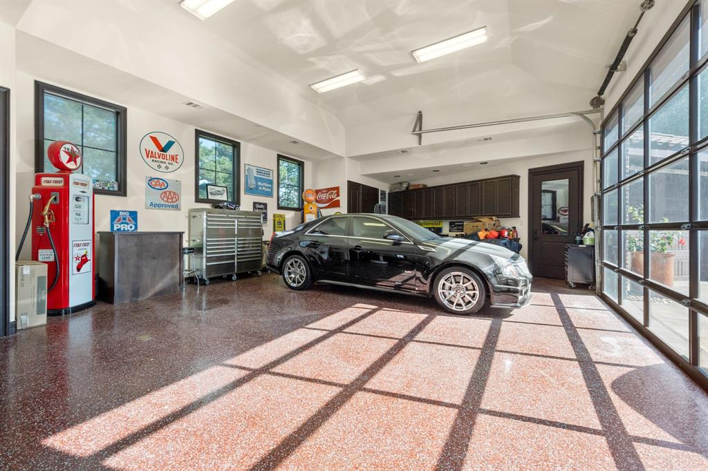 Glass front oversized doors make this showpiece not just a garage but a collectors dream.