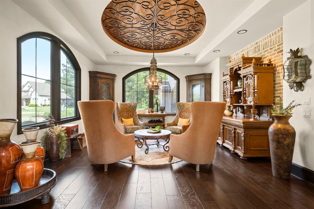Rich warm tones and dark wood flank both windows and bring incredible light to this subtle social space. Perfect for sipping wine.