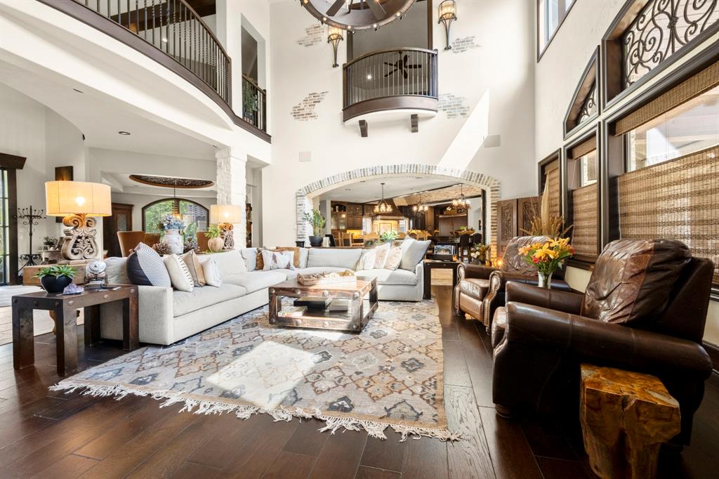 This floor plan while generous leaves at true open and home-style feeling of connectedness. Looking to the kitchen you will see the Juliet balcony that leads your eye into the upstairs living room.