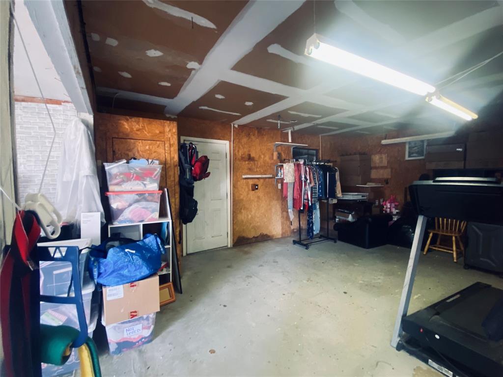 Room opens up to more garage parking.