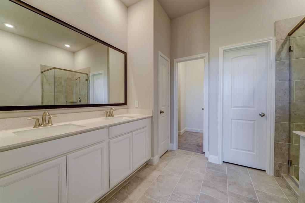 **Home is Under Construction. The photo shown here is of a completed home that has the same floor plan and similar elevation. Options and color selections may vary.**
